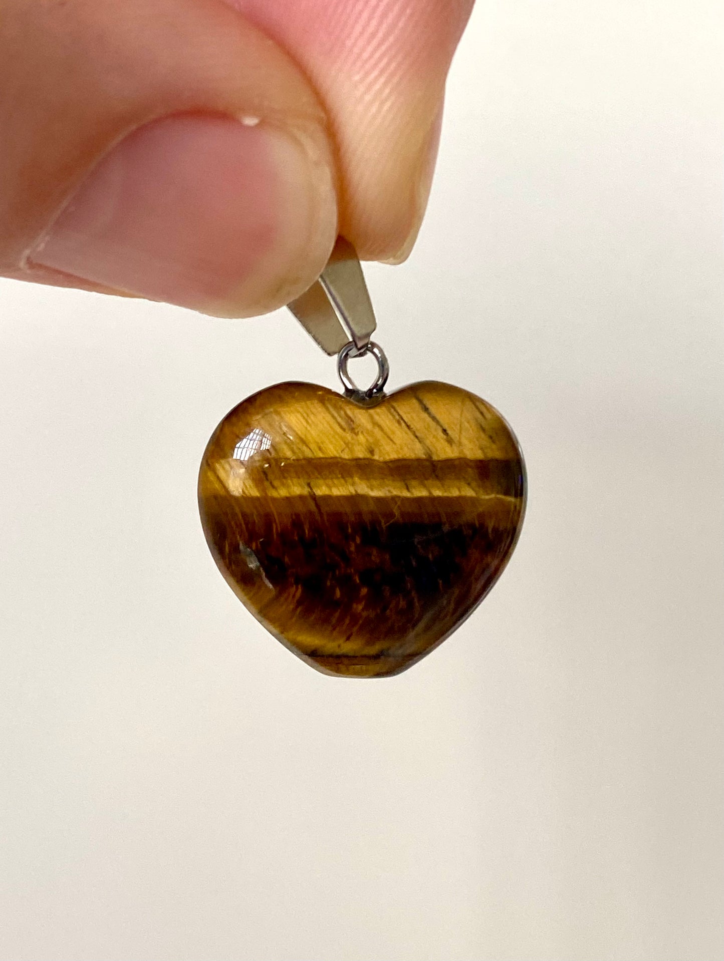 Tiger's Eye hart shaped pendant on necklace, mineral