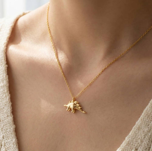 Necklace with stegosaurus pendant, gold-dipped dinosaur - FossilsAndMore