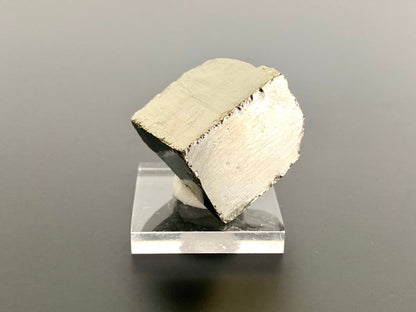 Small Pyrite cube on acrylic plate (Navajun, Spain) - FossilsAndMore